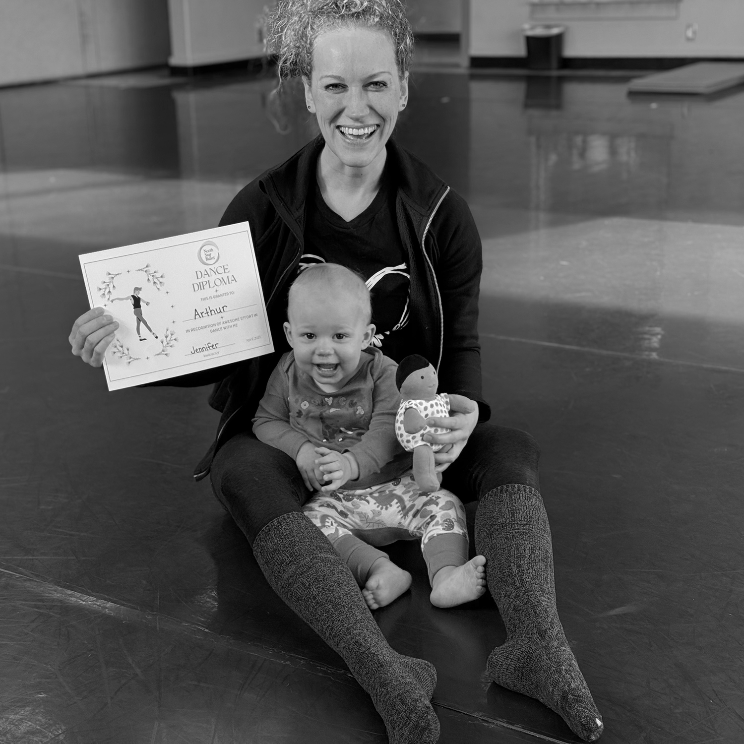Caregiver and toddler in ballet studio